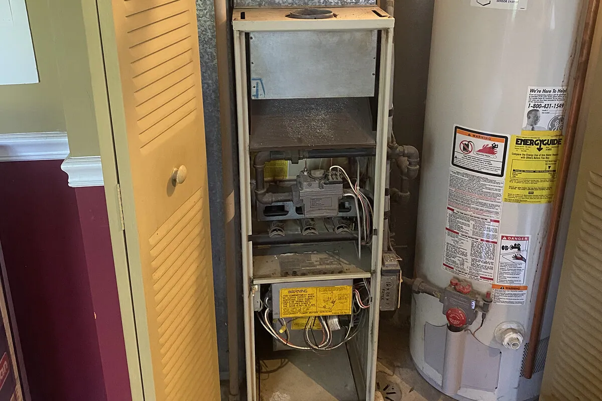 Before — furnace and water heater area